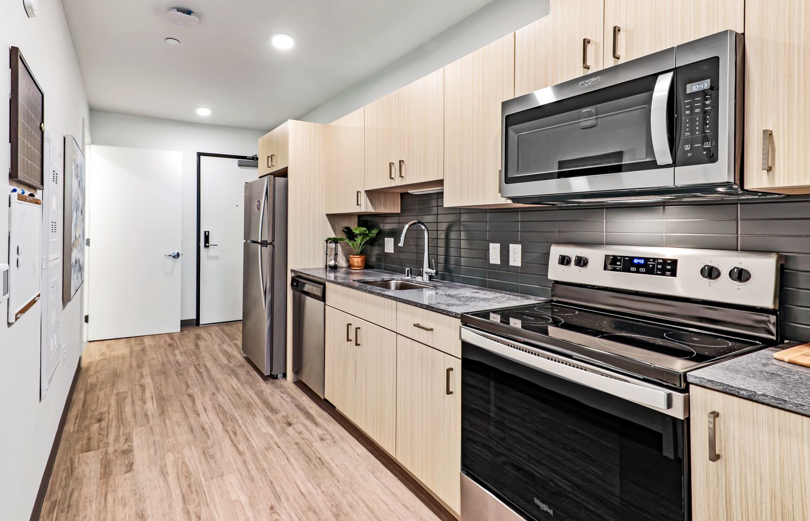 apartment kitchen with wood cabinets theory u district